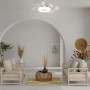 Ventilatore da soffitto bianco con luce LED in un soggiorno moderno.