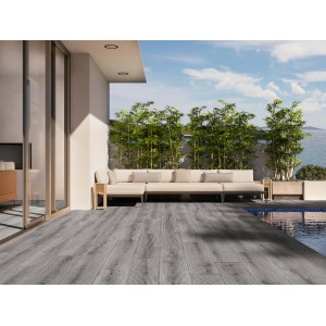 Piastrelle per pavimenti grigie su un patio con piscina e mobili lounge.