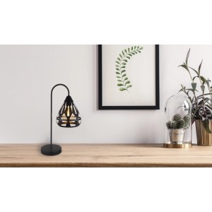 Lampada da tavolo di design nera con paralume in metallo filigranato per una luce d'atmosfera.