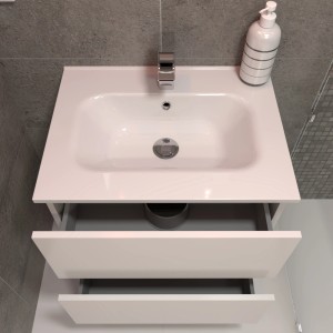 Lavabo singolo t.b.t. bianco con due cassetti e rubinetto su parete grigia.