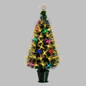 Piccolo albero di Natale artificiale illuminato con puntale a stella in vaso. Decorazione festiva.