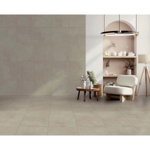 Piastrelle per pavimenti beige posate in un soggiorno. Piastrelle quadrate con motivi delicati.