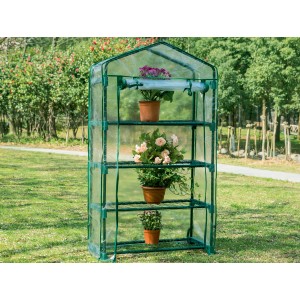 Piccola serra t.b.t. verde con tre ripiani e piante in vaso.