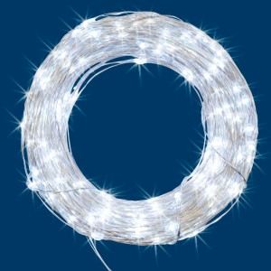 t.b.t. Catena luminosa per interni, arrotolata su sfondo blu.