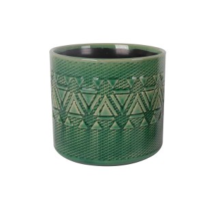 Vaso decorativo verde con motivo geometrico per piante da interno.