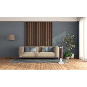 Stufa elettrica t.b.t. in soggiorno con divano e pianta.