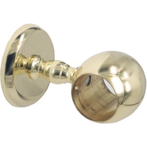 Dettaglio di una staffa a muro dorata per corrimano Corrimano.