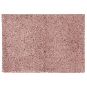 Tappeto a pelo lungo rosa per spazi abitativi.