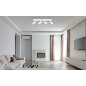 Faretto Globo Robby bianco, a 4 luci, in un soggiorno moderno. Plafoniera con quattro spot.