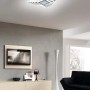 Plafoniera LED t.b.t. moderna con design curvo per montaggio a soffitto.