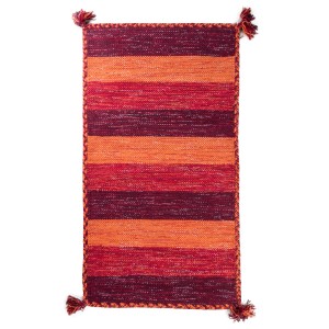 Tappeto da bagno t.b.t. a righe nei toni del rosso e dell'arancione.