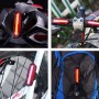 Luce per bici t.b.t. fissata a casco, manubrio, ruota e zaino.