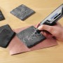 Miniutensile Dremel Lite 7760-15 che incide sottobicchieri in ardesia.
