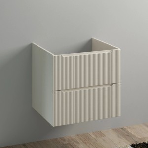 Mobile bagno sospeso beige con cassetti scanalati.