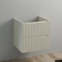 Mobile bagno sospeso beige con cassetti scanalati.