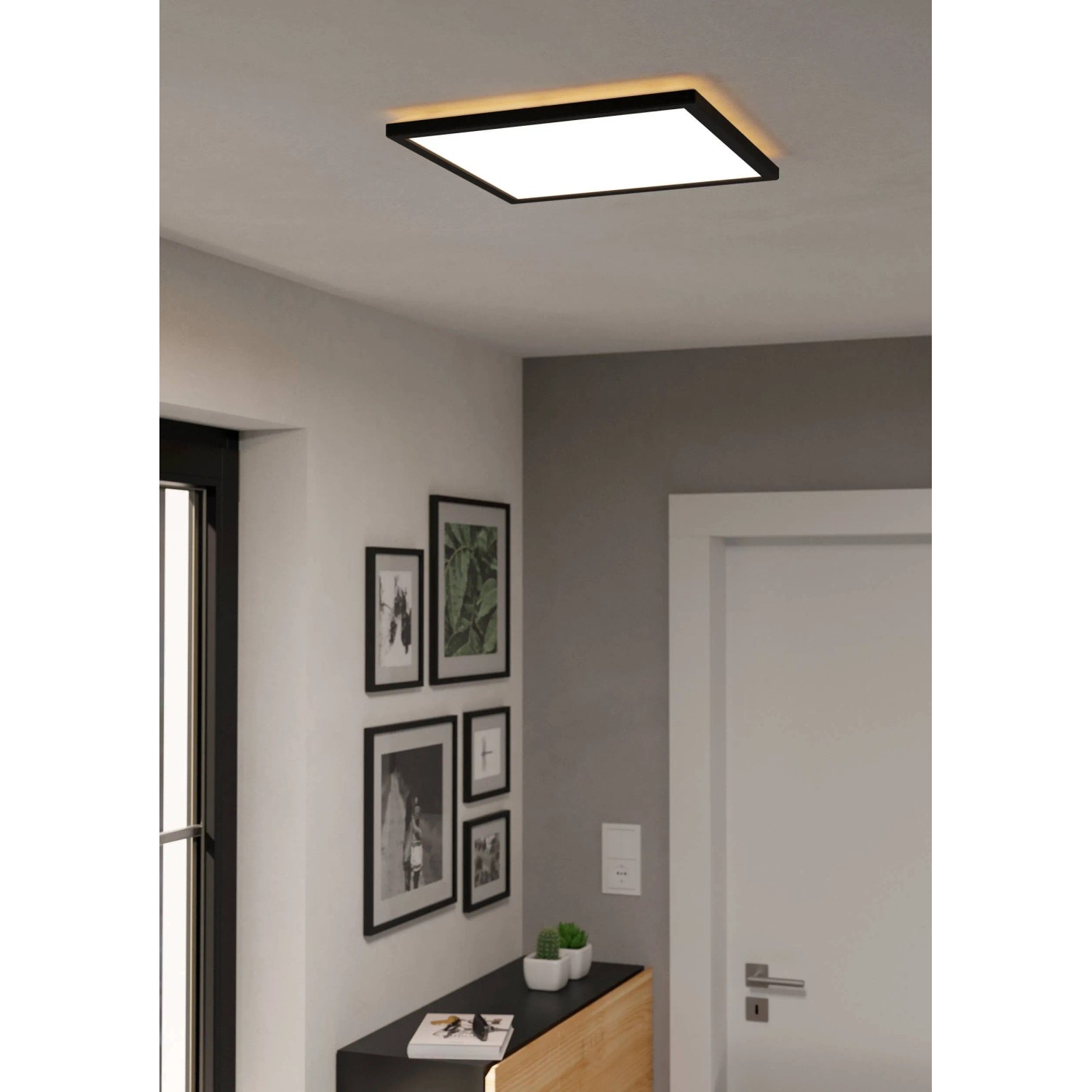 Plafoniera LED quadrata nera Eglo Rovito con superficie illuminante bianca. Lampada da soffitto moderna per spazi abitativi.