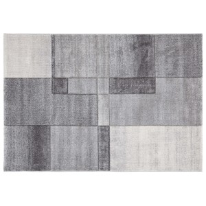 Tappeto moderno con motivo geometrico nei toni del grigio e bianco.