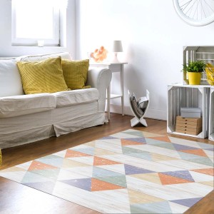 Tappeto moderno con motivo geometrico in colori pastello. Ideale per spazi abitativi.